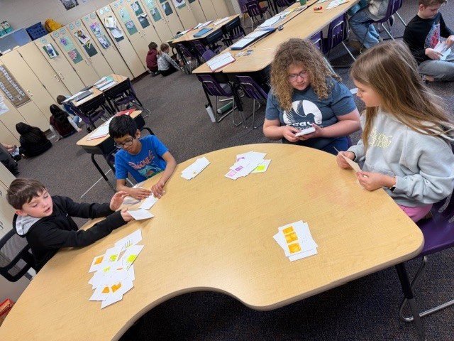 students working together to play a game