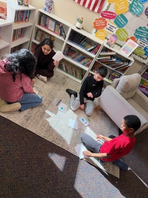 students talking about a fraction game