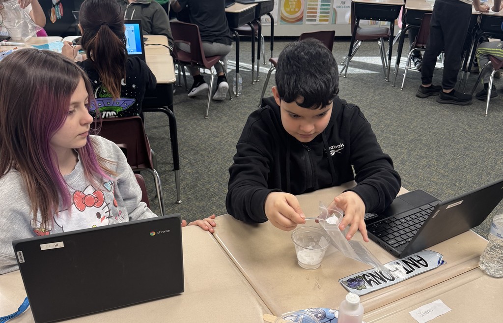 boy and girl doing science