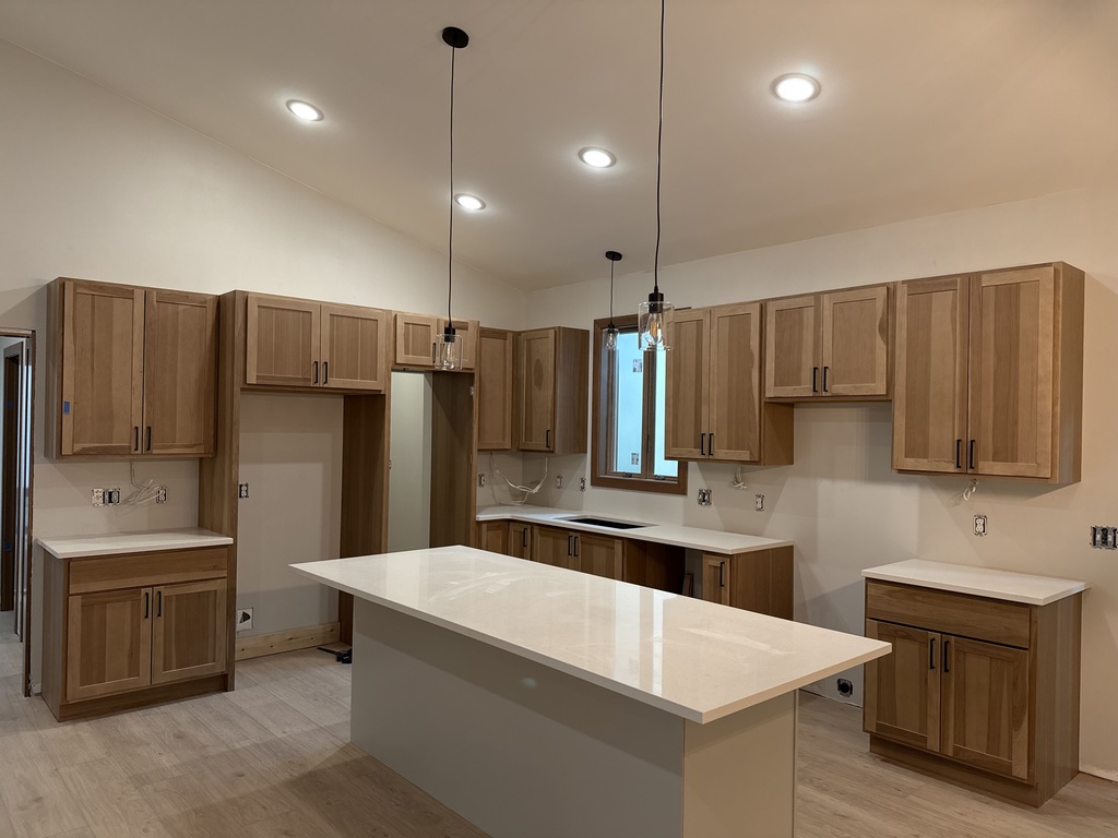 CTE house kitchen with flooring, cabinets, and counter tops!