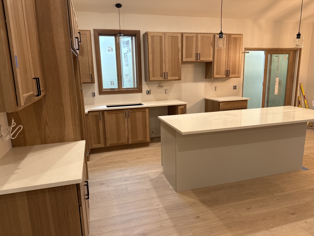 CTE house kitchen with flooring, cabinets, and counter tops!