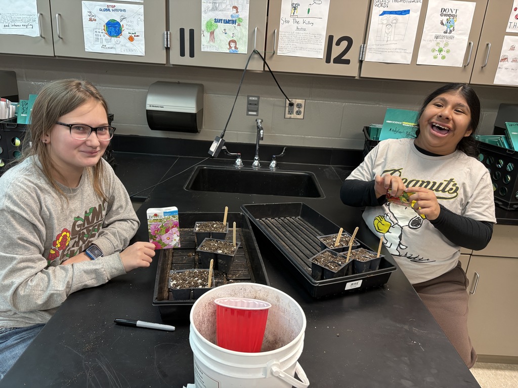 Garden club planting seeds. 