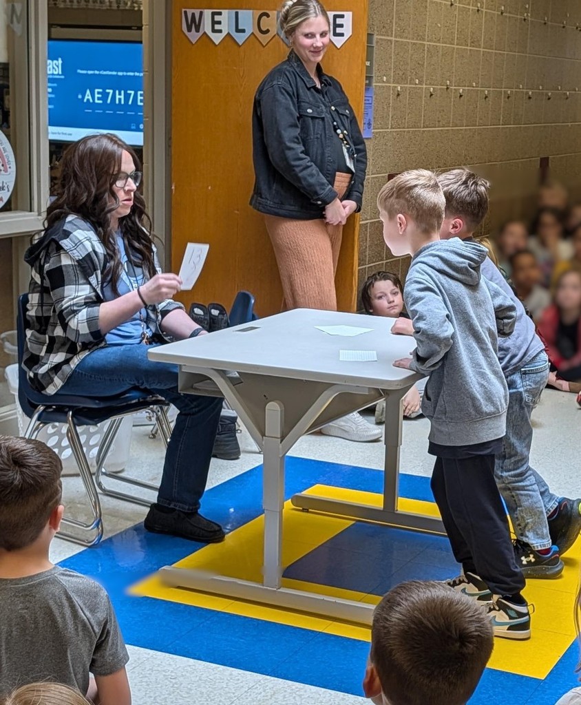 First grade boys doing math flash cards. 