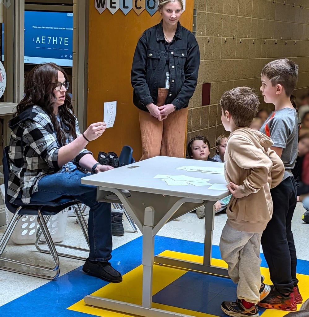 First grade boys doing math flash cards. 