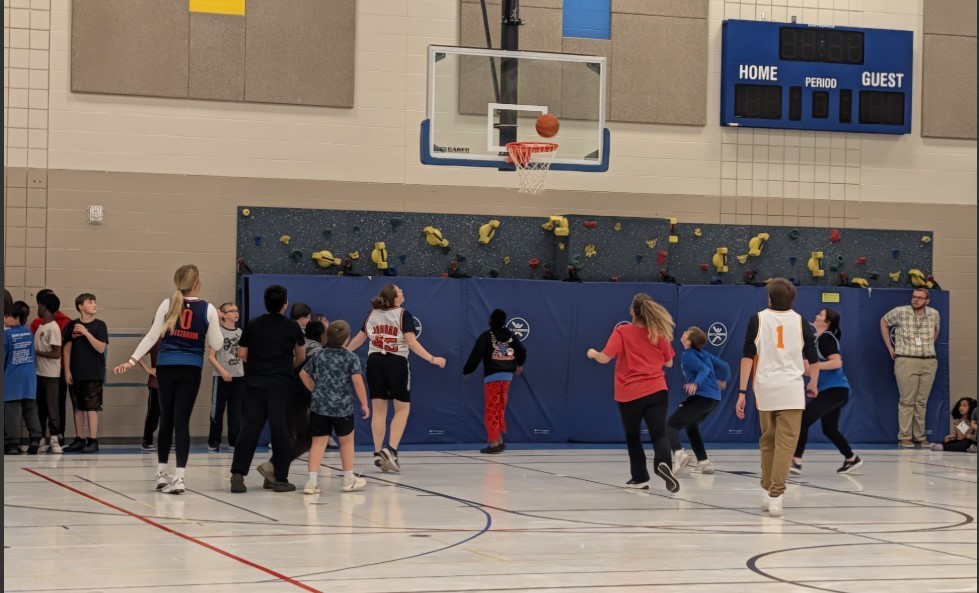 Staff vs 5th graders in basketball.