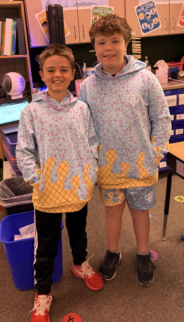 two students dressed in the same shirt 