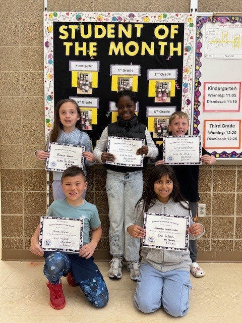 Third grade students of the month holding their certificates