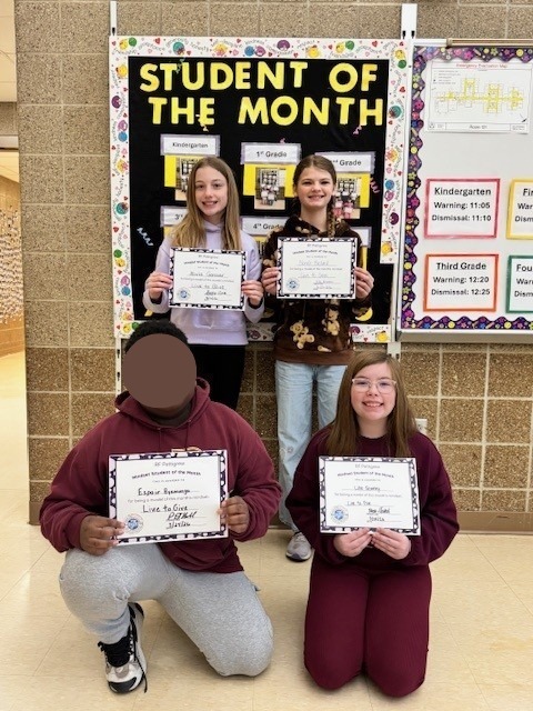 Fifth grade students of the month holding their certificates