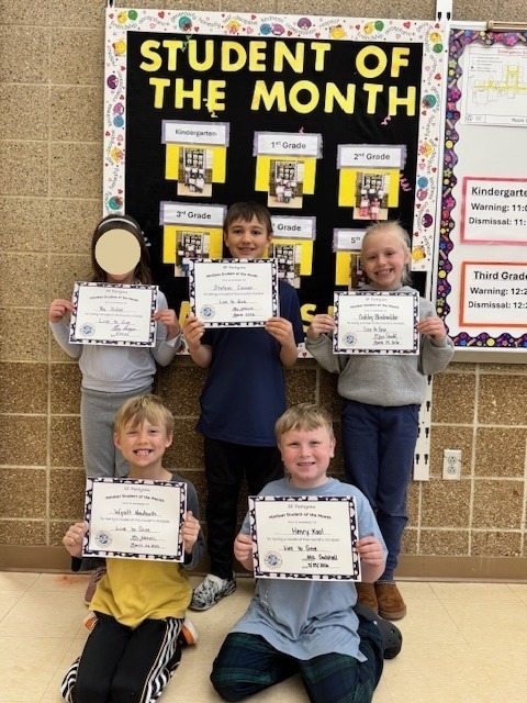 Second grade students of the month holding their certificates