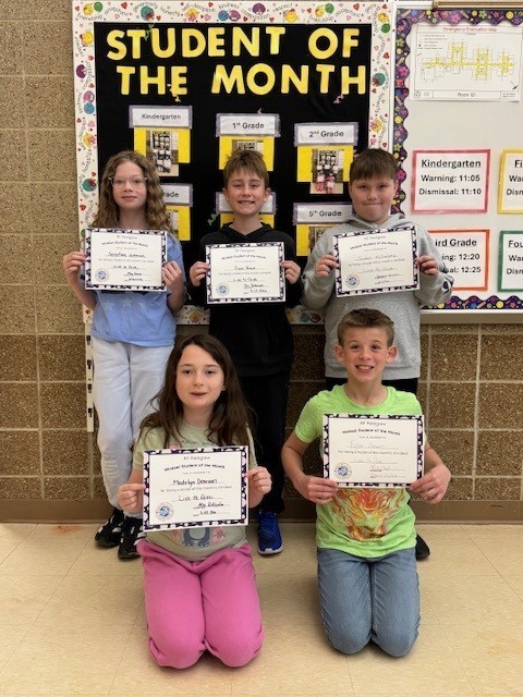 Fourth grade students of the month holding their certificates