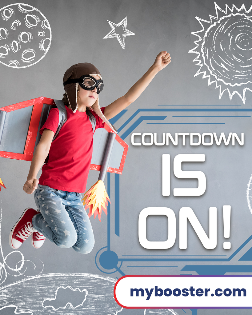 gray background with chalk drawings of space objects, child in aviator cap and goggles wearing homemade rocket wings pretending to blast off in space