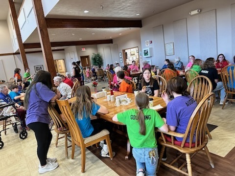 Expressions socializing with nursing home residents. 