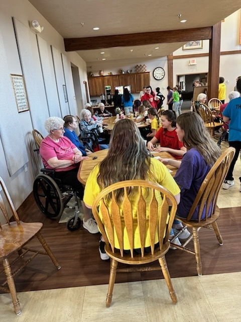 Expressions socializing with nursing home residents. 
