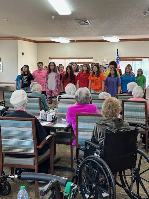 Expressions performing at nursing home. 