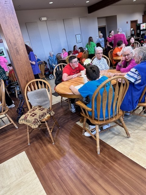 Expressions socializing with nursing home residents. 