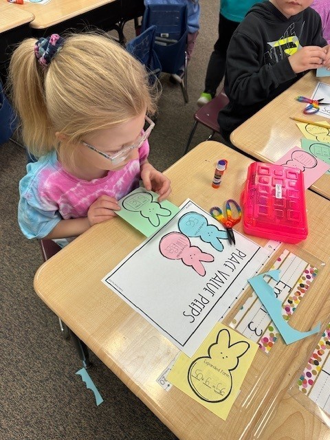 student cutting out peep shape