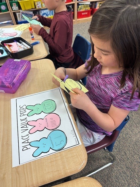 student cutting out peep shape