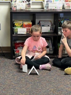 student building a tower