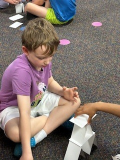 students using science to build a tower