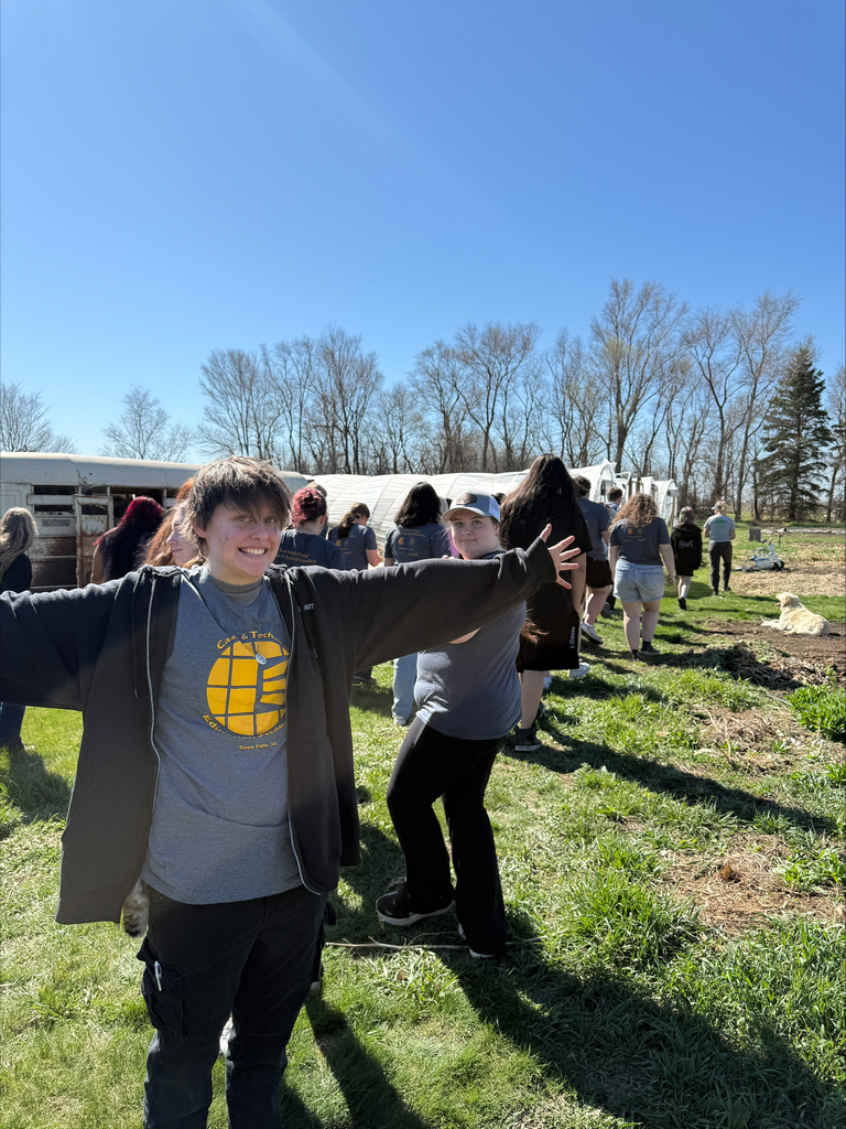 students posing for a picture outside