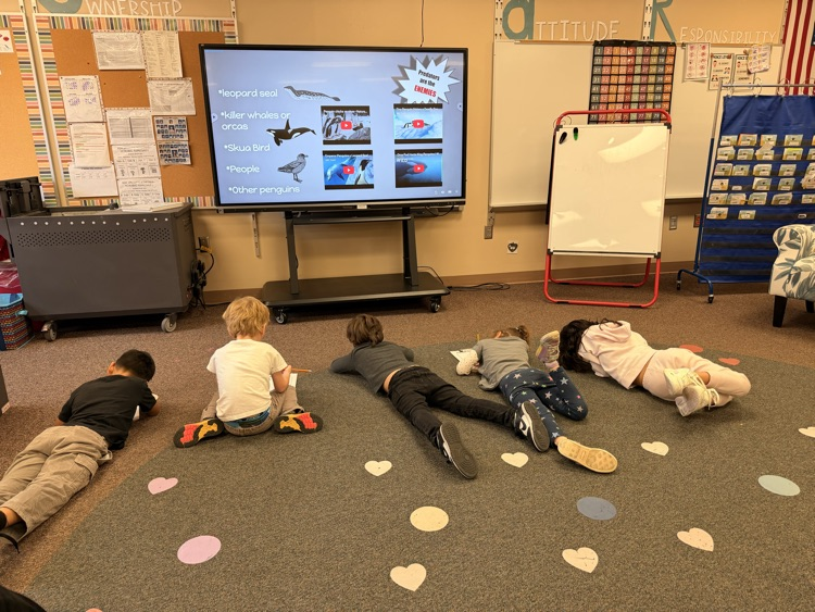 students working on a project on the floor 