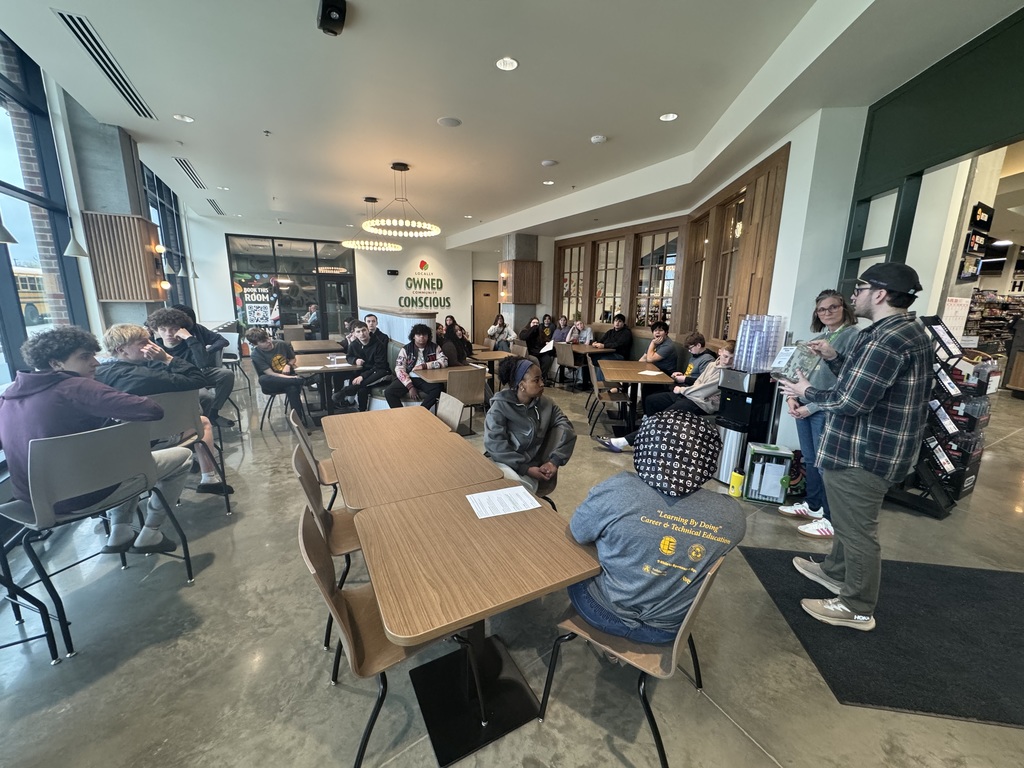 Students touring Pomegranate Market's new location downtown