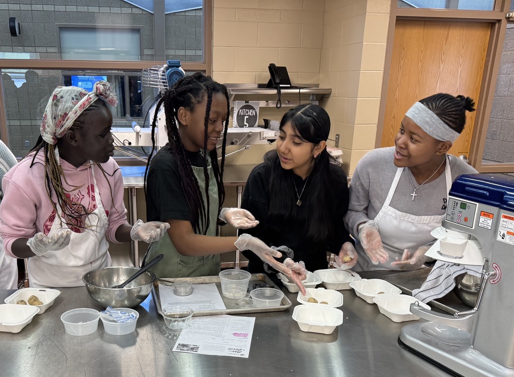 Students baking their creations in the kitchen
