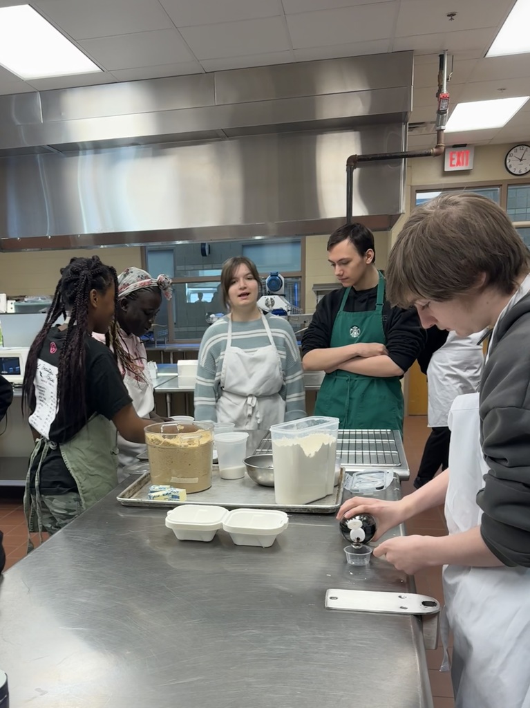 Students baking their creations in the kitchen