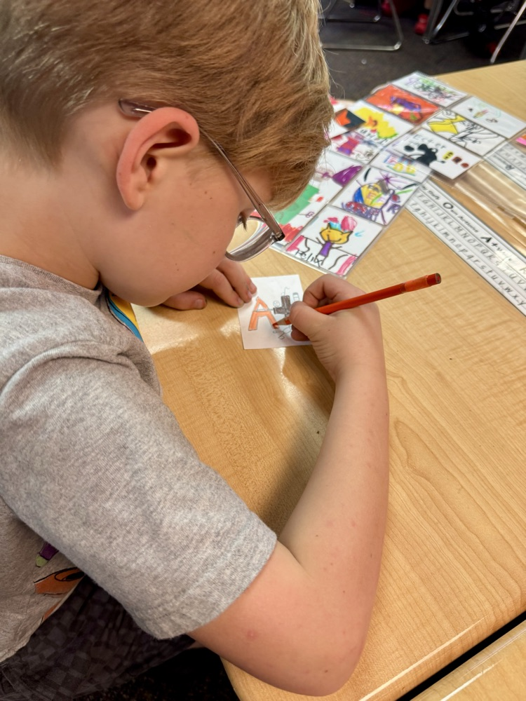 Student working on an artist trading card 