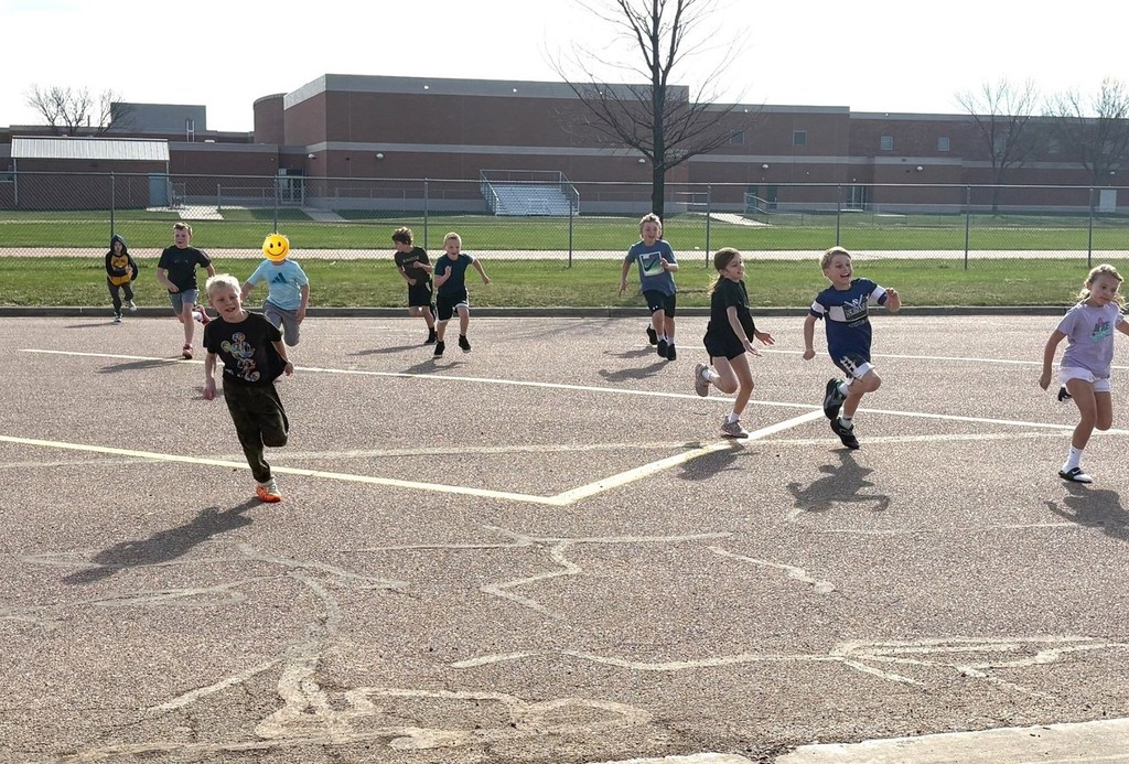Students running at recess. 