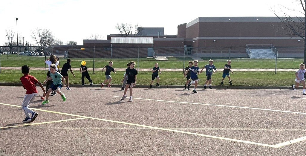 Students running at recess. 