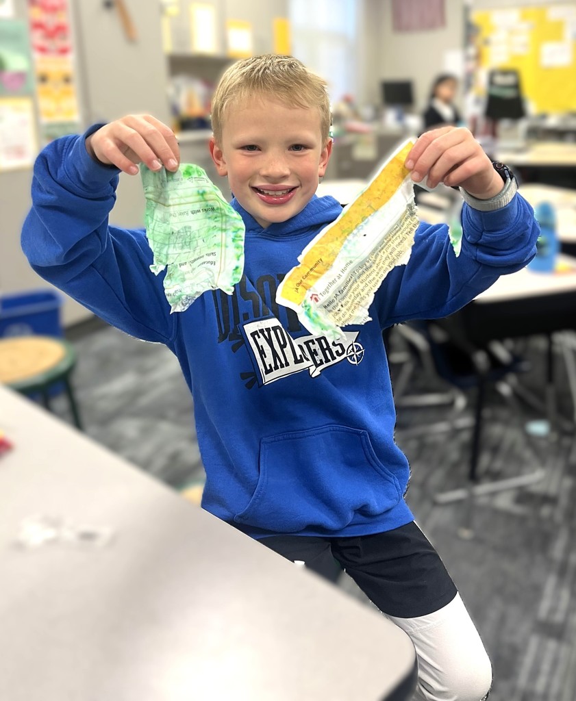 Student holding a ripped/torn worksheet. 