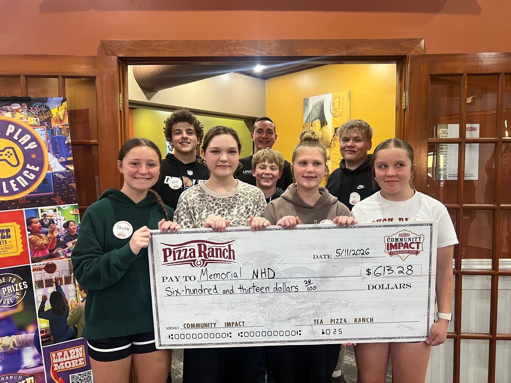 A group of Memorial Middle School students pose together inside Tea Pizza Ranch holding a large ceremonial check made out to Memorial NHD for $613.28, dated May 11, 2026. The check is from the Pizza Ranch Community Impact Fundraising Event. Several students are wearing Community Impact name tags. A Pizza Ranch staff member stands in the background smiling.