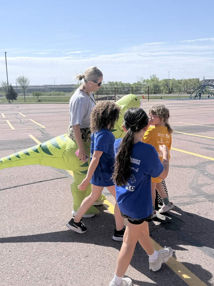staff member and students at the Fun Run 