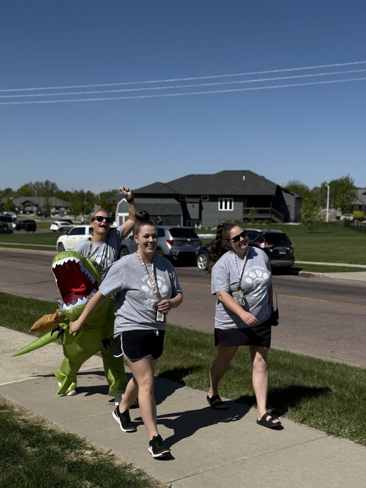 three staff members running 