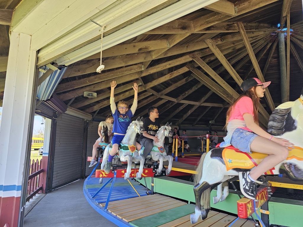 2 boys on a carousel