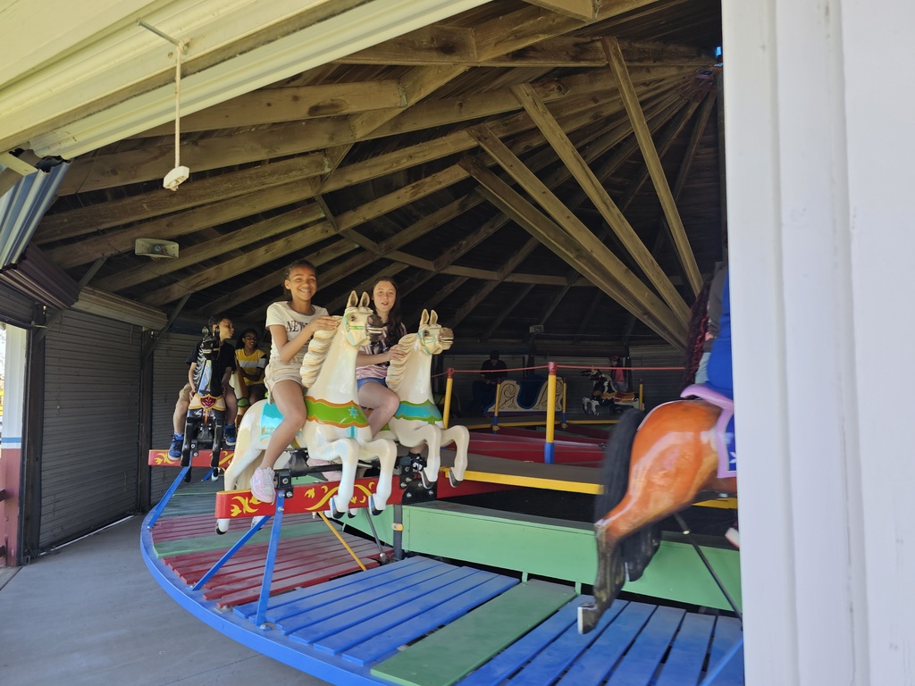 2 girls on a carousel