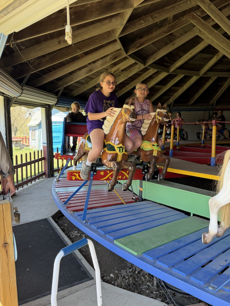 2 girls on a carousel