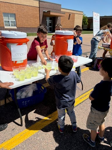 early childhood students getting lemonade