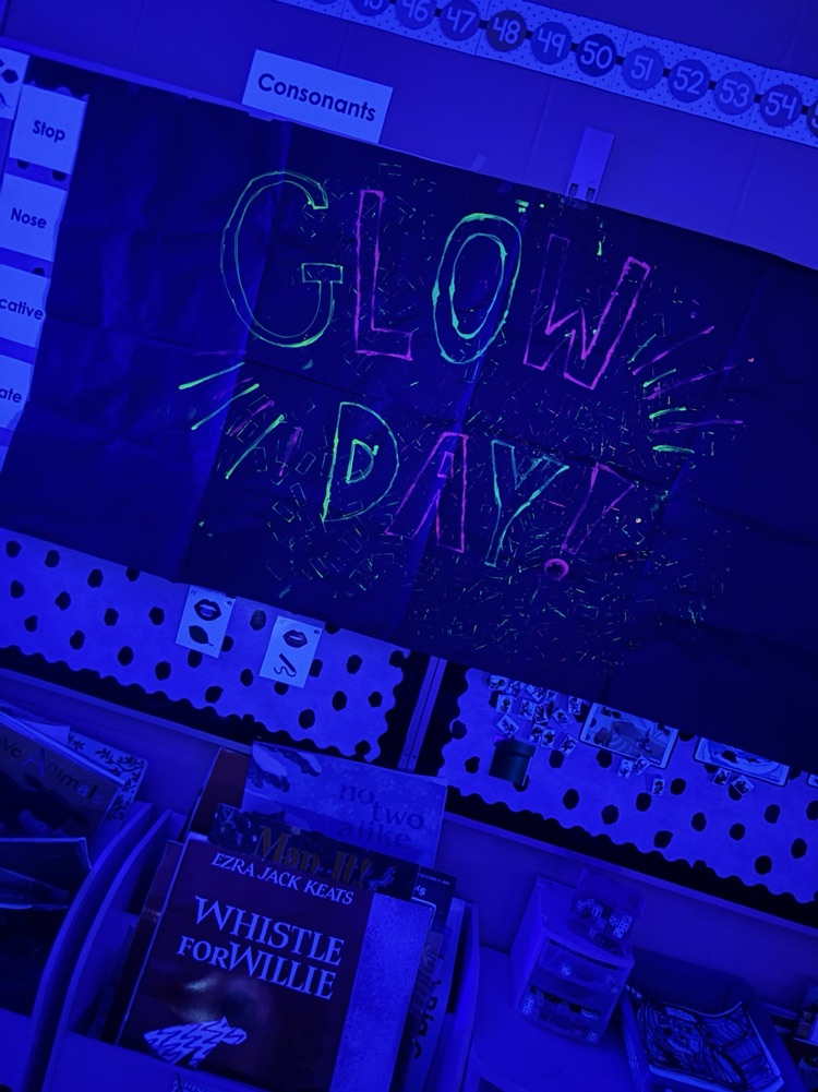 a classroom glowing with a black light