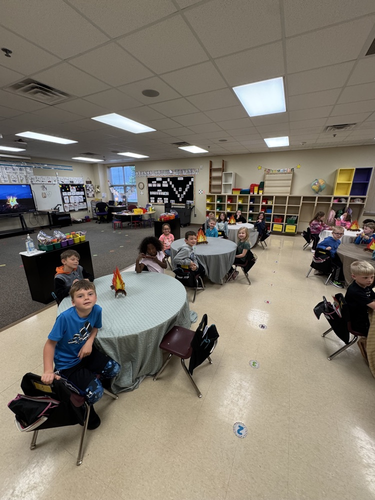students camping in their classroom