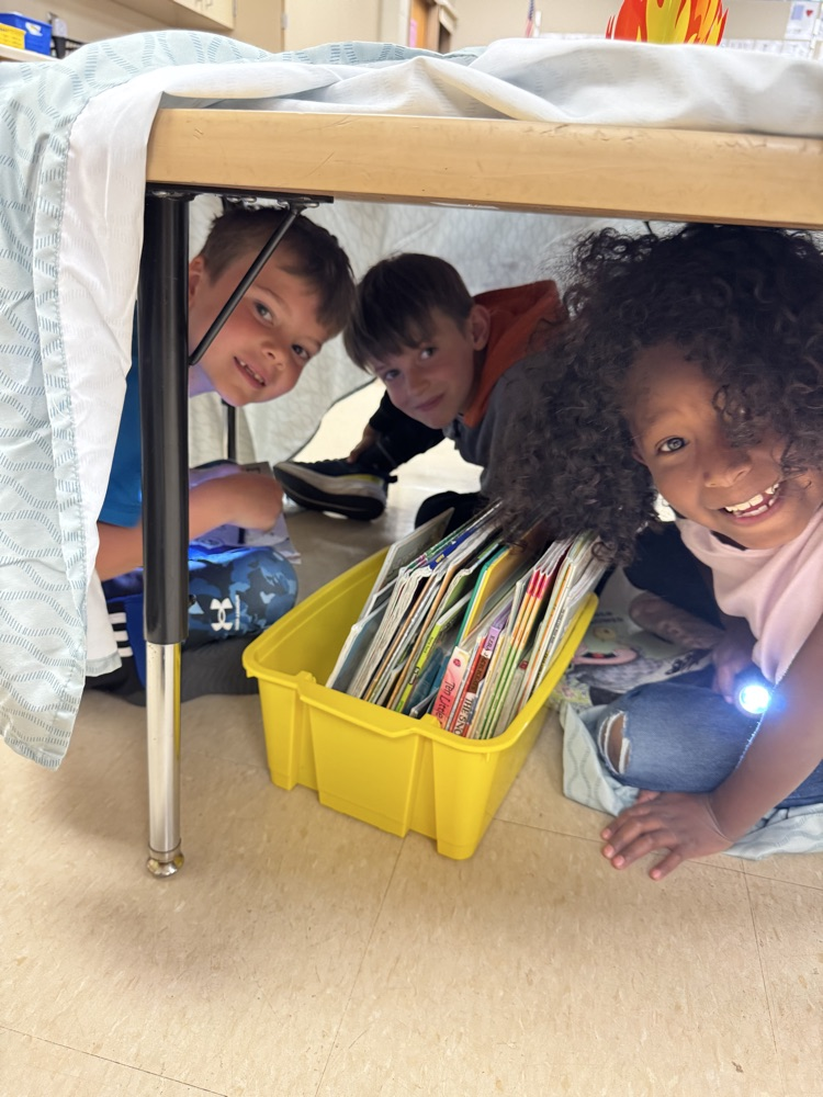 students camping in their classroom