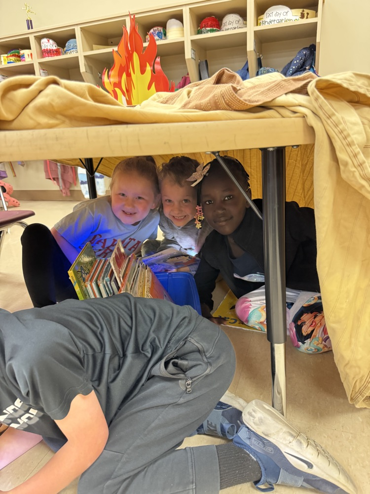 students camping in their classroom