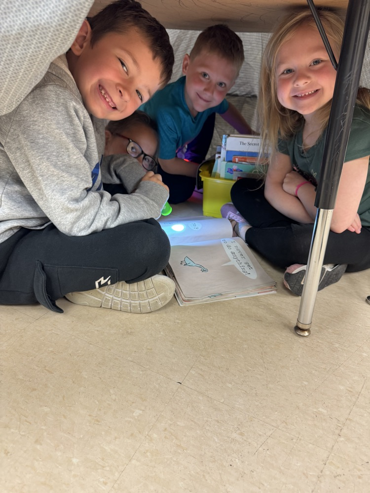 students camping in their classroom