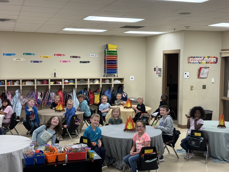 students camping in their classroom
