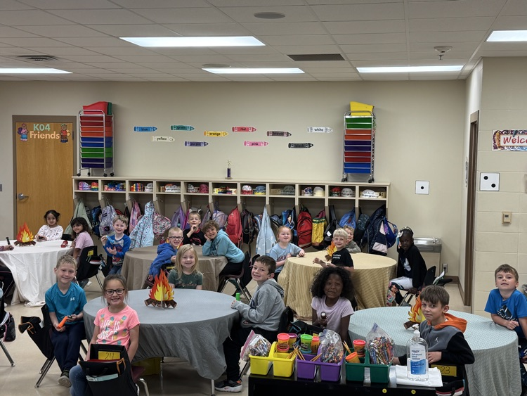 students camping in their classroom