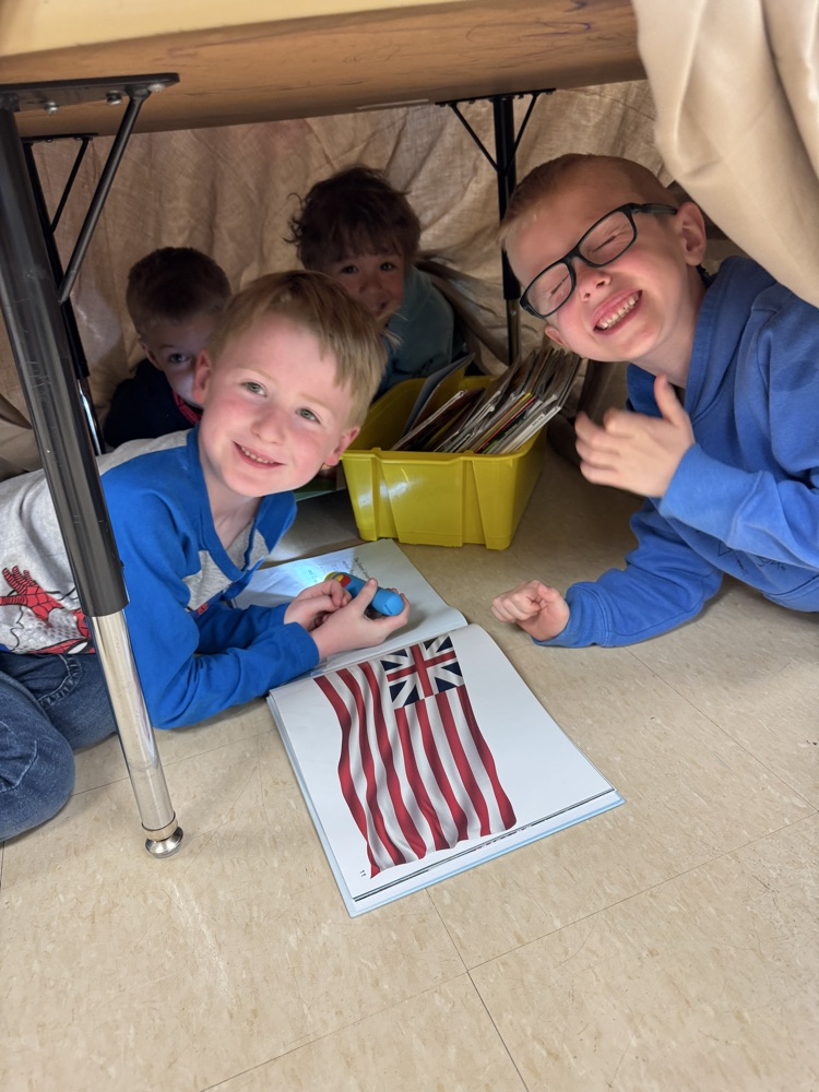 students camping in their classroom