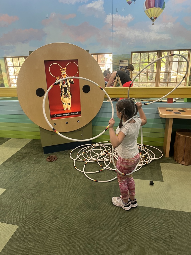 girl playing with hoops