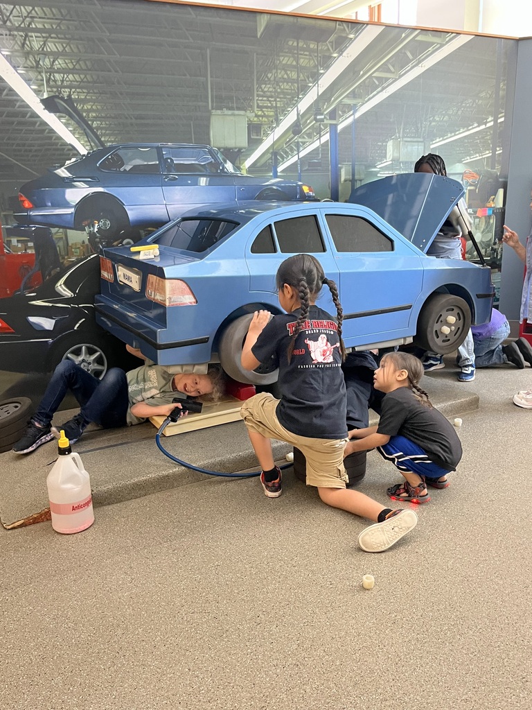 boys playing with a car