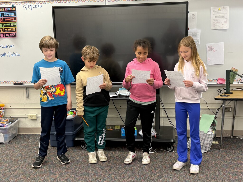 4 students reading a play